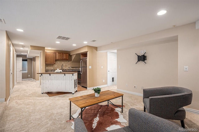 7624 Russell Ct, Arvada, CO 80007 - living area with light colored carpet, baseboards, and recessed lighting