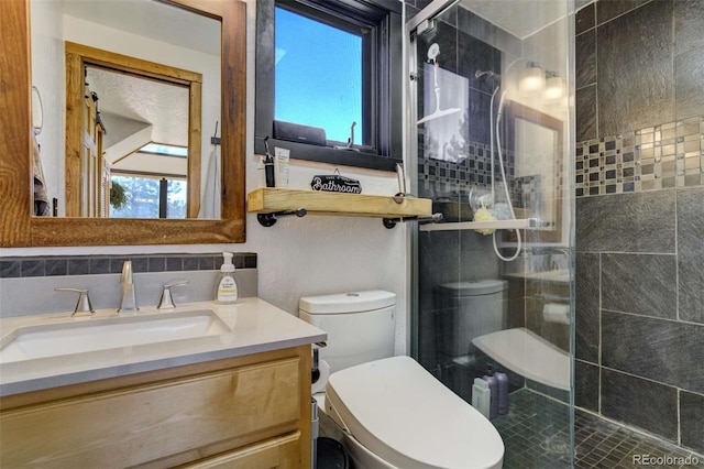 full bath featuring a shower stall, healthy amount of natural light, vanity, and toilet