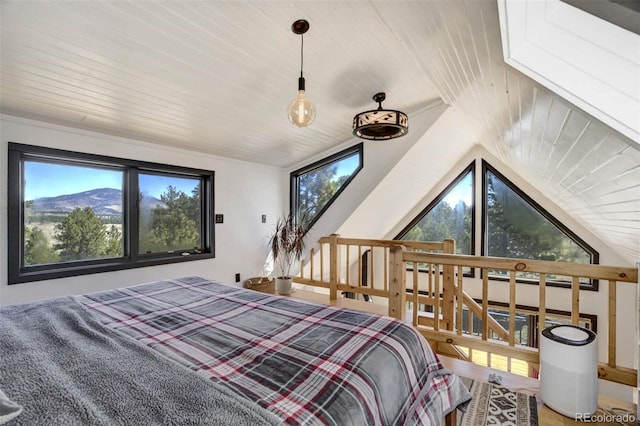 bedroom featuring wooden ceiling, multiple windows, and lofted ceiling