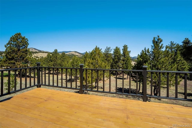 wooden terrace featuring a mountain view