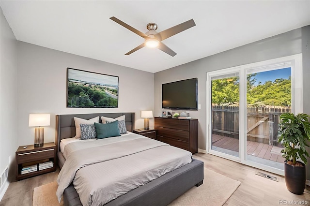 3090 W 107th Pl Unit F, Westminster, CO 80031 - bedroom featuring access to exterior, light wood-type flooring, and ceiling fan