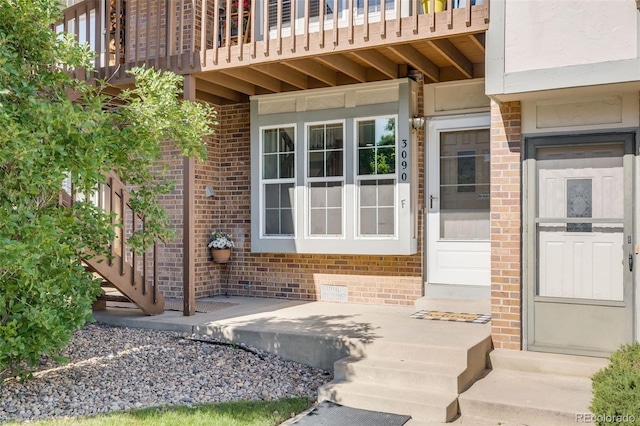 3090 W 107th Pl Unit F, Westminster, CO 80031 - view of exterior entry featuring brick siding and a balcony