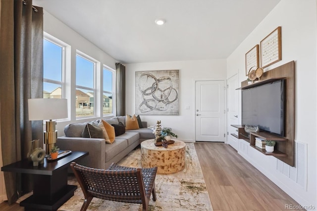 22384 E 6th Pl, Aurora, CO 80018 - living room featuring wood finished floors and baseboards