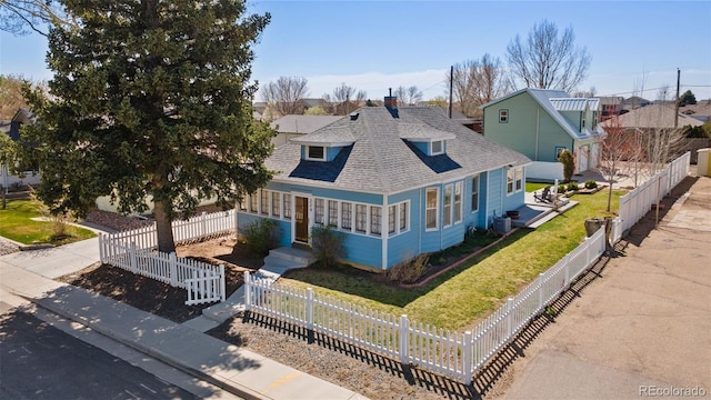 224 4th Ave, Severance, CO 80550 - view of front of house featuring roof with shingles, a fenced front yard, and a residential view