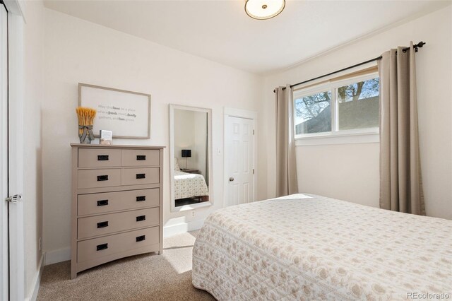 224 4th Ave, Severance, CO 80550 - bedroom featuring light colored carpet and baseboards