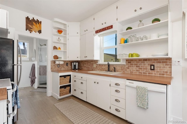 224 4th Ave, Severance, CO 80550 - kitchen featuring white appliances, open shelves, white cabinetry, and decorative backsplash
