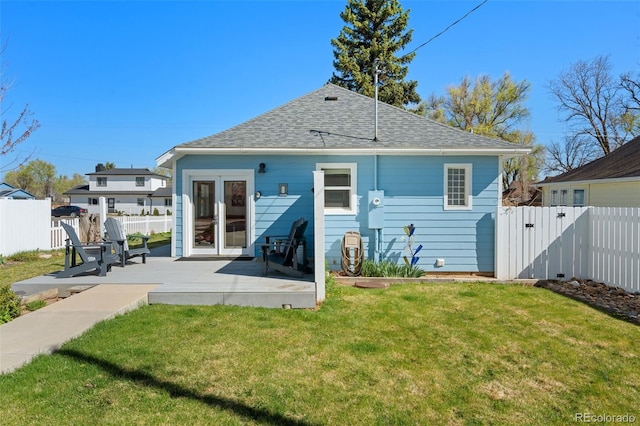 224 4th Ave, Severance, CO 80550 - back of property with a patio and roof with shingles