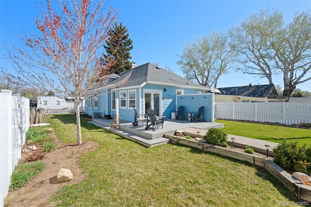224 4th Ave, Severance, CO 80550 - back of house featuring a fenced backyard, a wooden deck, and french doors