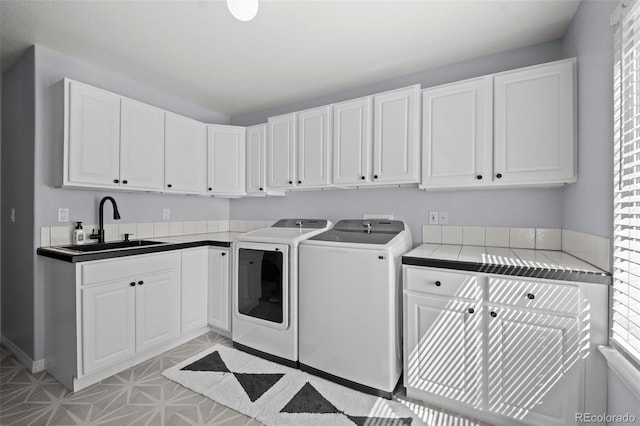 2062 Hyacinth Rd, Highlands Ranch, CO 80129 - laundry room with washer and clothes dryer and cabinet space