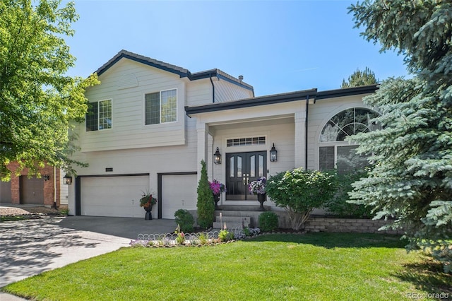 2062 Hyacinth Rd, Highlands Ranch, CO 80129 - view of front of home featuring a garage, a front yard, driveway, and french doors