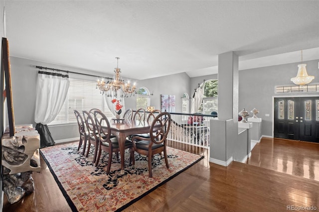 2062 Hyacinth Rd, Highlands Ranch, CO 80129 - dining area with a chandelier and wood finished floors