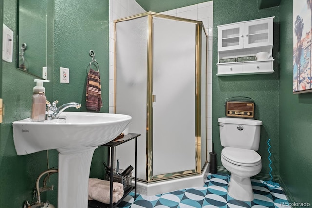 2062 Hyacinth Rd, Highlands Ranch, CO 80129 - bathroom with a textured wall, a stall shower, and tile patterned floors