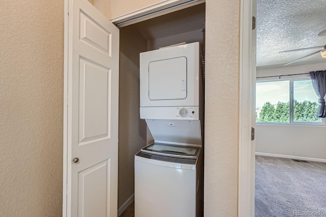 washroom with carpet, stacked washer / drying machine, a textured ceiling, and ceiling fan