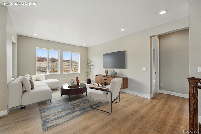 17196 W 92nd Loop, Arvada, CO 80007 - living area featuring light wood-style flooring, recessed lighting, and baseboards