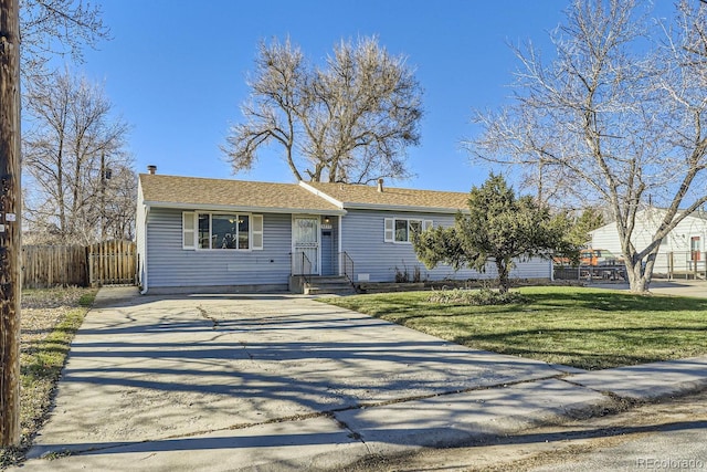 ranch-style home with a front lawn