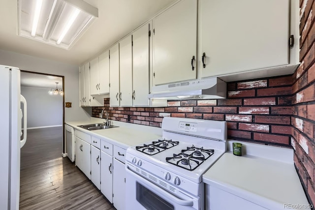 kitchen featuring dark hardwood / wood-style flooring, sink, white cabinets, and white appliances