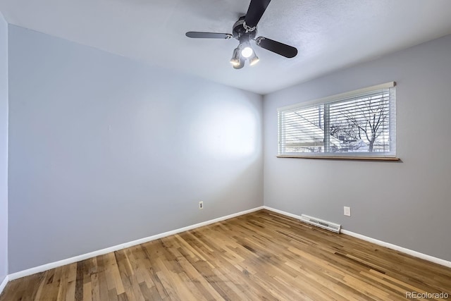 spare room featuring ceiling fan and light wood-type flooring