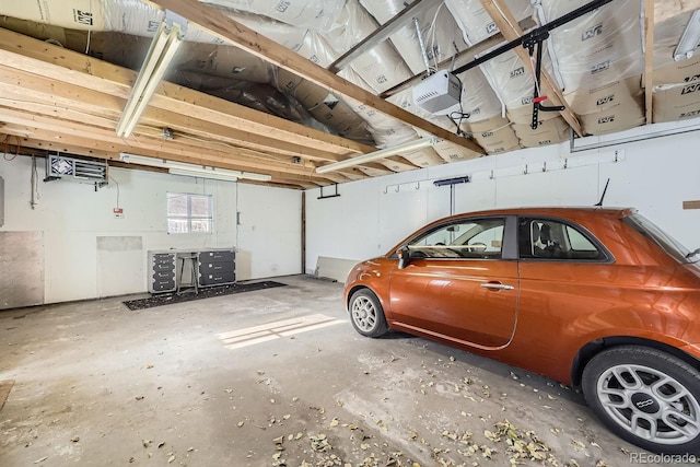 garage featuring secured water heater