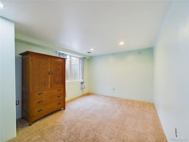 unfurnished bedroom with light carpet