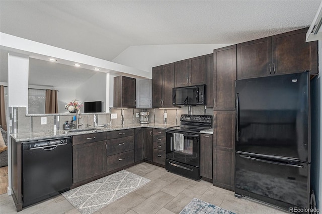 kitchen featuring backsplash, dark brown cabinetry, lofted ceiling, black appliances, and a sink