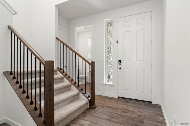 foyer entrance with hardwood / wood-style floors