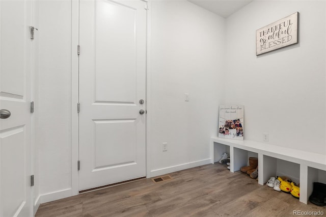 mudroom with light hardwood / wood-style flooring