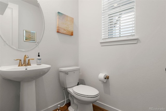 bathroom with toilet and sink