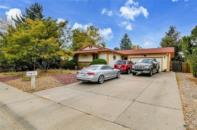 single story home featuring a garage