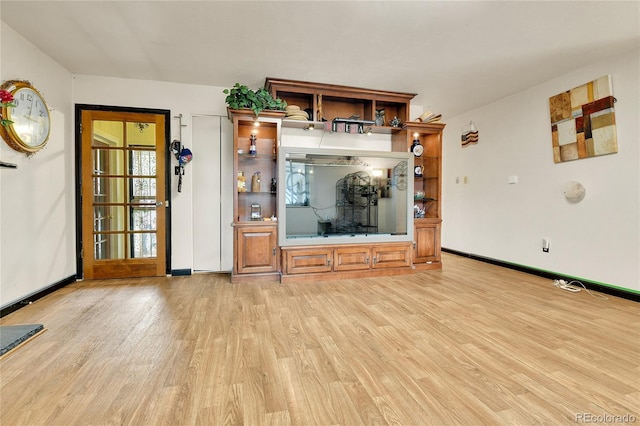 unfurnished living room featuring light hardwood / wood-style floors