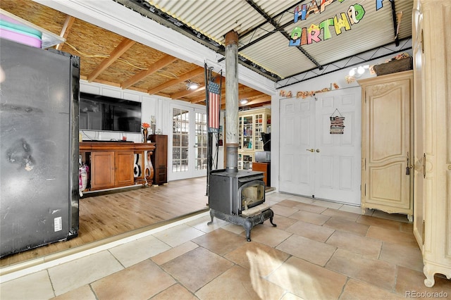 interior space featuring a wood stove and light wood-type flooring