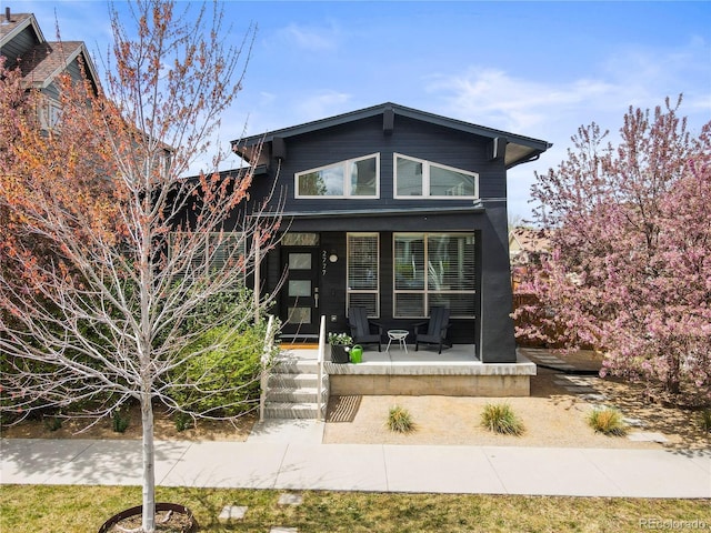 2777 Ironton St, Denver, CO 80238 - modern home featuring covered porch