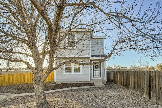 view of front of house featuring a fenced backyard