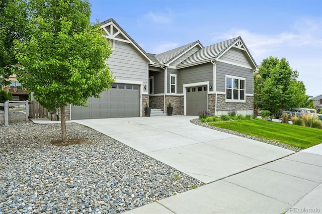 16256 Ute Peak Way, Broomfield, CO 80023 - view of front of property featuring an attached garage, driveway, and stone siding