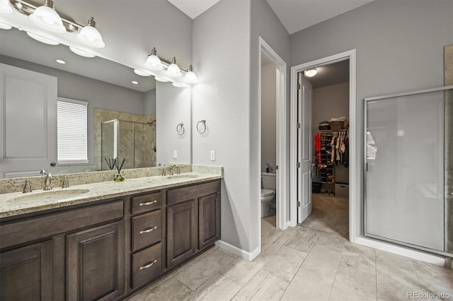 16256 Ute Peak Way, Broomfield, CO 80023 - full bathroom featuring a stall shower, double vanity, and a spacious closet