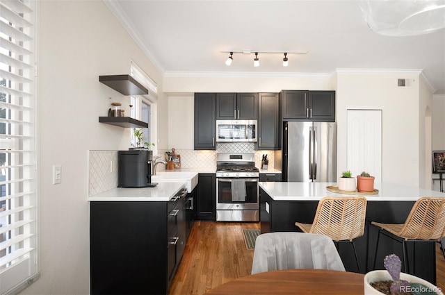 kitchen featuring visible vents, open shelves, appliances with stainless steel finishes, crown molding, and dark cabinets