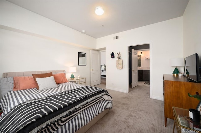 bedroom with visible vents, light colored carpet, and baseboards