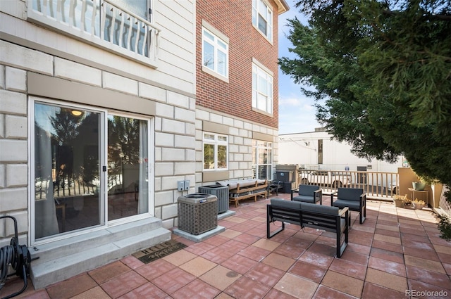 view of patio / terrace with central air condition unit and an outdoor hangout area