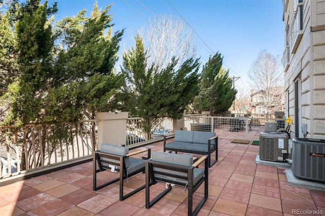 view of patio / terrace featuring an outdoor living space and central air condition unit