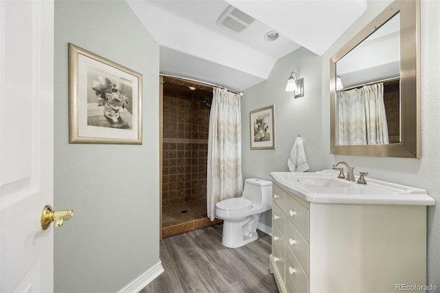 404 Yarrow Pl, Castle Pines, CO 80108 - full bath with wood finished floors, tiled shower, vanity, and toilet