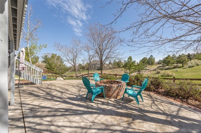 404 Yarrow Pl, Castle Pines, CO 80108 - view of property's community featuring a patio, stairway, a fire pit, and fence