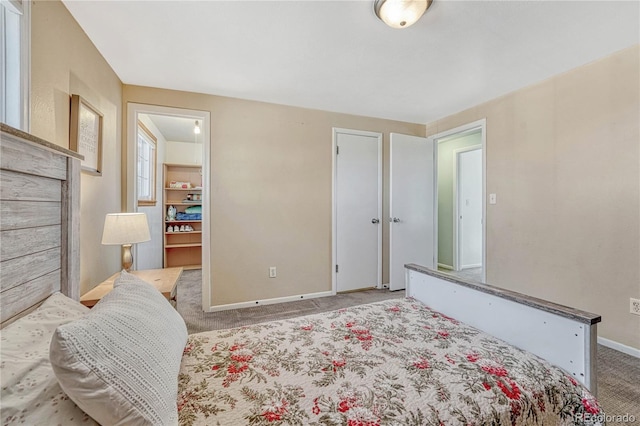 bedroom featuring baseboards and carpet floors