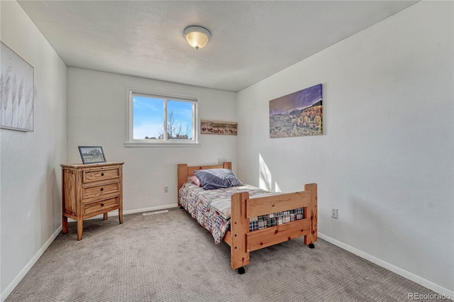 carpeted bedroom with baseboards