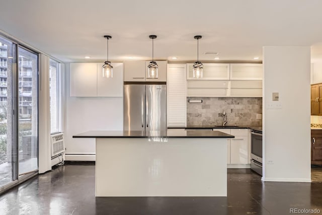 kitchen with white cabinets, stainless steel appliances, plenty of natural light, and decorative light fixtures