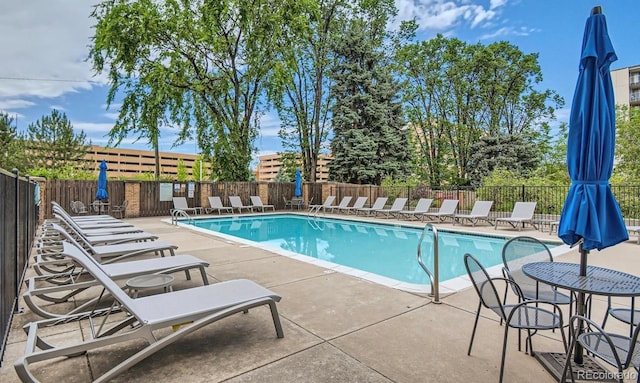 view of swimming pool featuring a patio