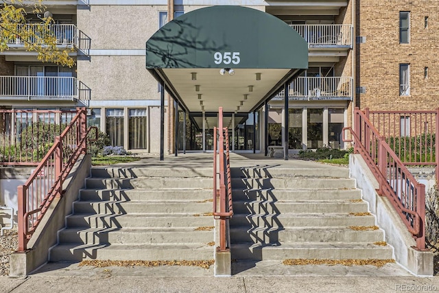 doorway to property featuring a balcony