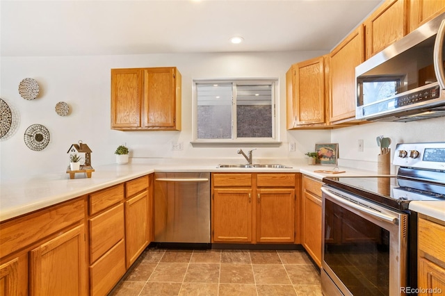 kitchen with sink and appliances with stainless steel finishes