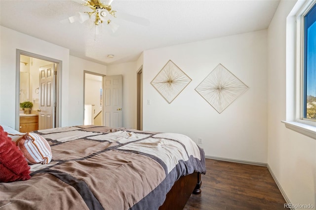 bedroom featuring ensuite bath, ceiling fan, and dark hardwood / wood-style floors