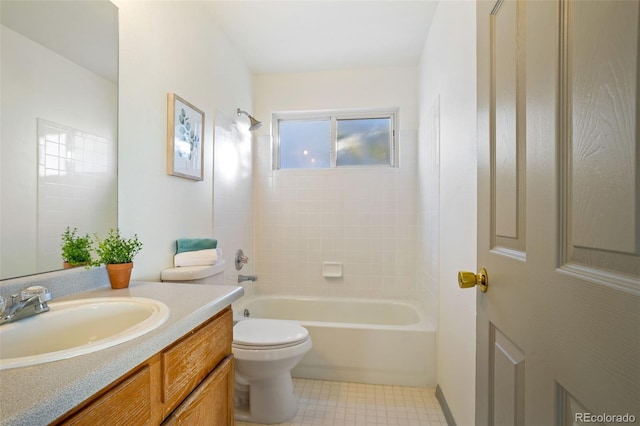 full bathroom featuring vanity, tiled shower / bath combo, and toilet