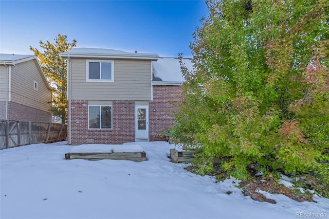 view of snow covered property