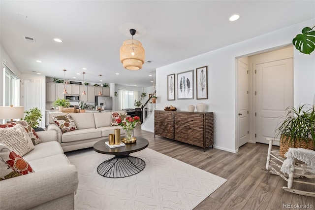 living room with light hardwood / wood-style flooring